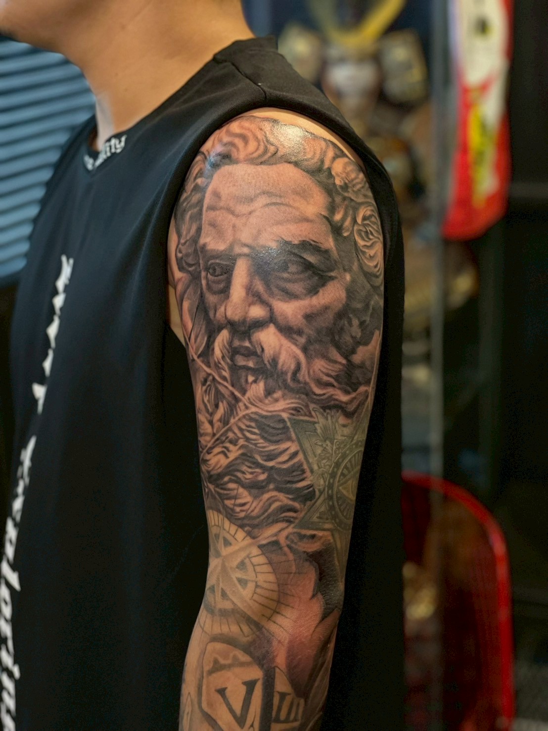 Greek mythology portrait half-sleeve tattoo