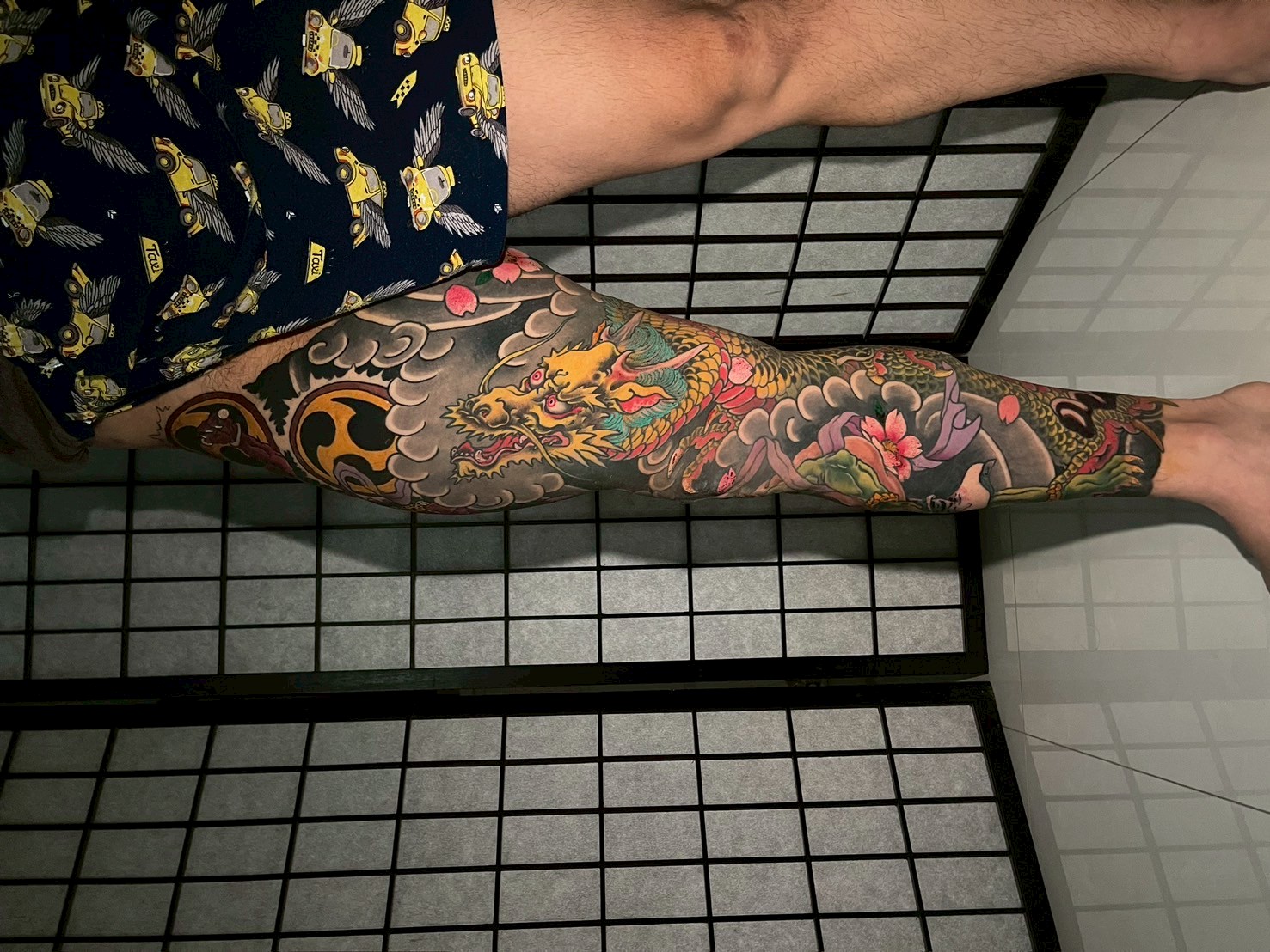 Colorful Japanese dragon leg sleeve tattoo