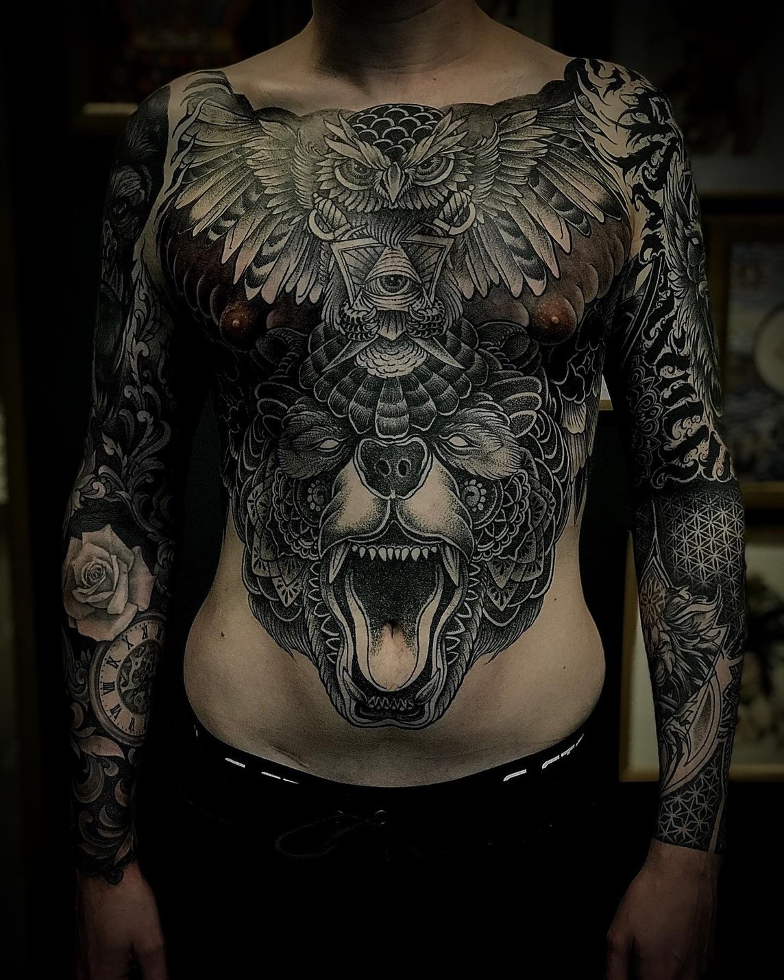 Intricate bear and owl full chest tattoo