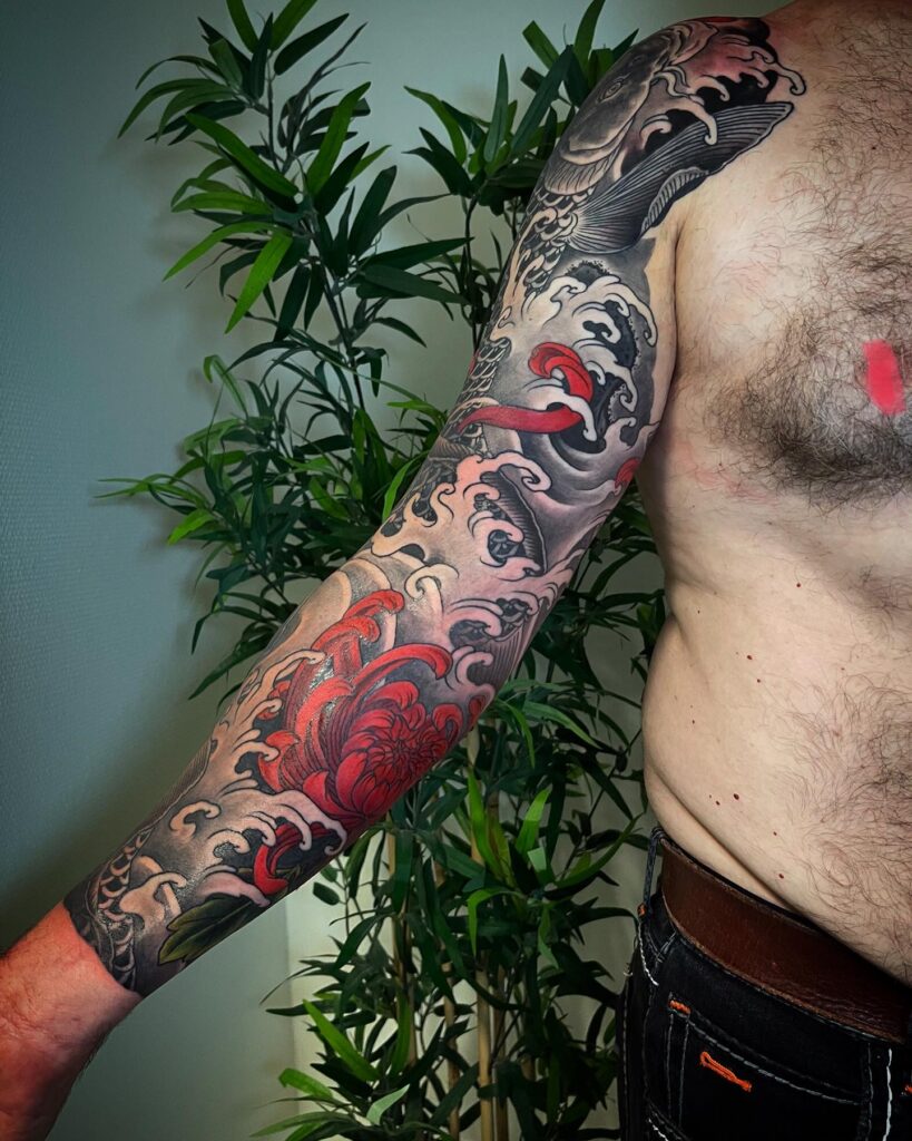 Japanese irezumi red peony forearm sleeve tattoo Pattaya