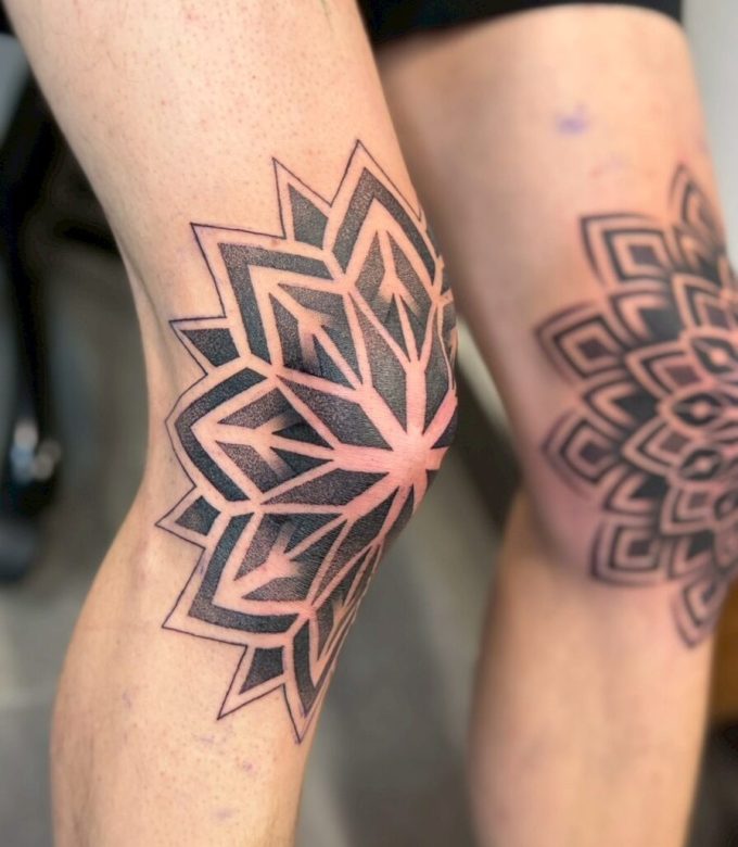 Geometric mandala thigh tattoo in Pattaya, bold blackwork mandala by Dragon King Tattoo