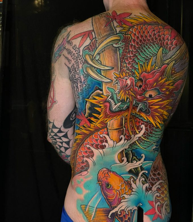 Japanese dragon and koi full back tattoo side view by Dragonking Tattoo Pattaya