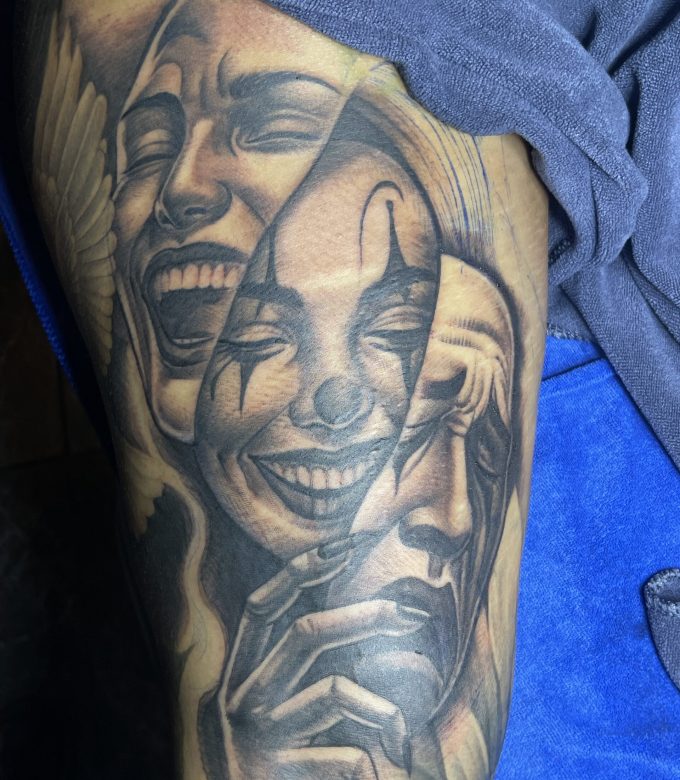 Realism arm tattoo with multiple face expressions and emotional portrait by Dragonking Tattoo Pattaya