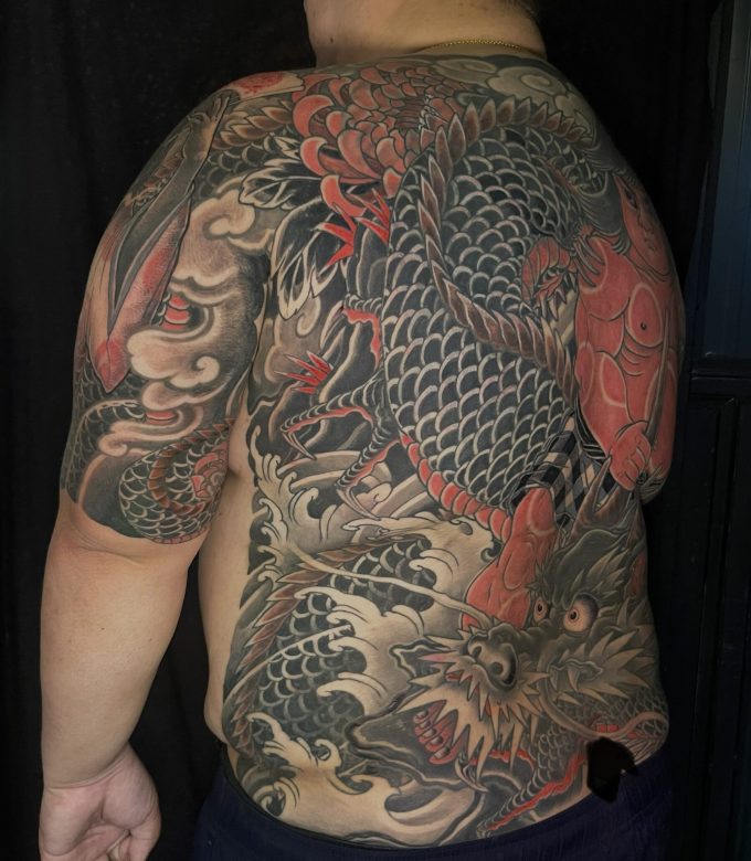 Japanese dragon and Kintaro full back tattoo side view by Dragonking Tattoo Pattaya