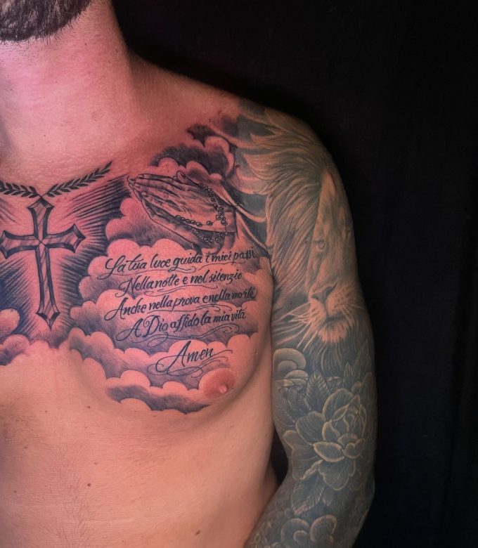 Religious chest tattoo with praying hands, rosary and Italian prayer script by Dragonking Tattoo Pattaya