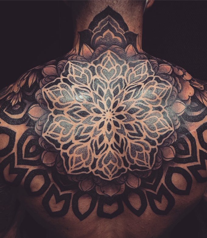 Custom full back mandala tattoo with detailed sacred geometry blackwork in Pattaya