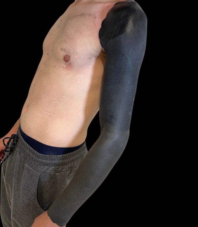 Men’s blackout full sleeve tattoo in Pattaya – side view