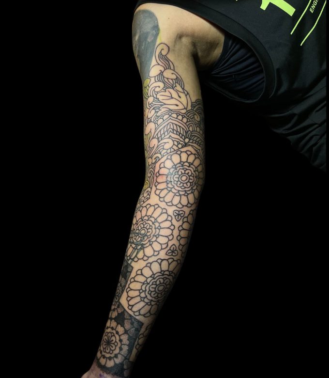 Floral Mandala blackwork cover up tattoo on full arm in Pattaya