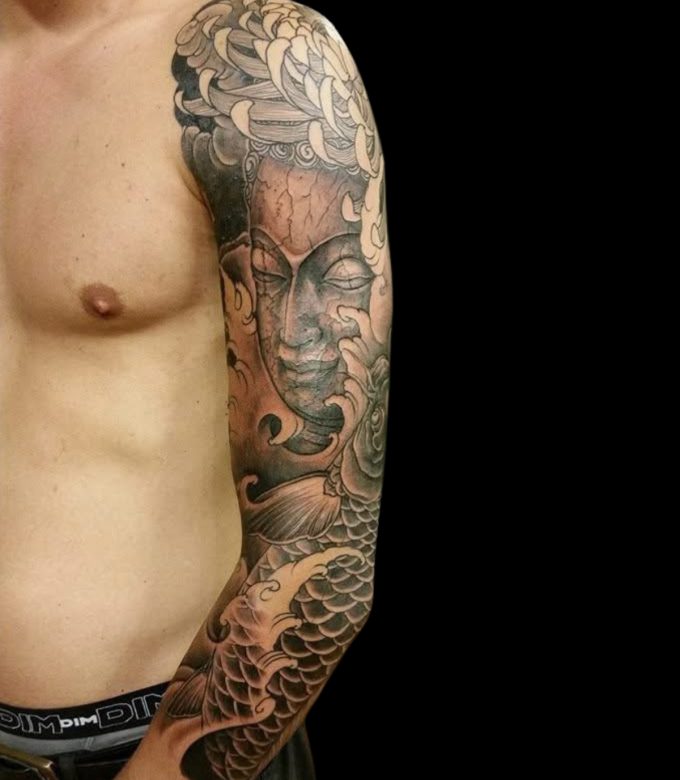 Black and grey Buddha Japanese full sleeve tattoo in Pattaya
